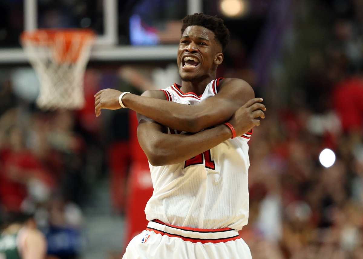 Apr 18, 2015; Chicago, IL, USA; Chicago Bulls guard Jimmy Butler (21) reacts after making a three-point basket against the Milwaukee Bucks during the second quarter in game one of the first round of the 2015 NBA Playoffs at United Center. Mandatory Credit: Jerry Lai-USA TODAY Sports